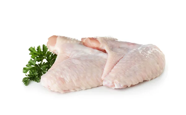 パセリの白い背景の上に生の手羽先 新鮮な肉 — ストック写真