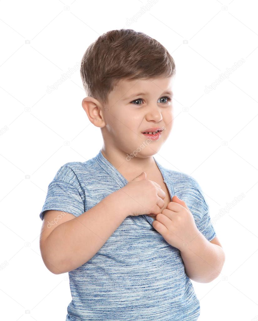 Little boy scratching chest on white background. Annoying itch