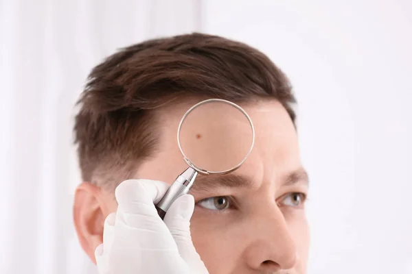 Dermatologist Examining Patient Magnifying Glass Clinic Closeup View — Stock Photo, Image