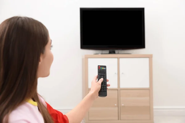 Woman Changing Channel Remote Control Living Room Space Text — Stock Photo, Image