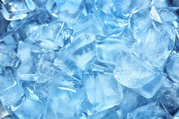 Many ice cubes on color background, top view