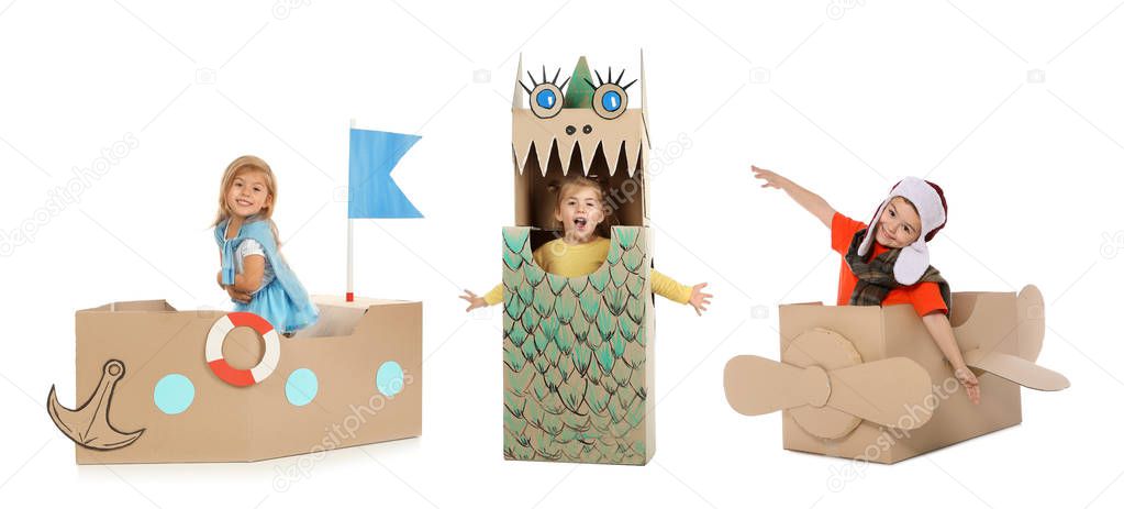 Little cute children playing with cardboard boxes on white background. Handmade toys and costumes 