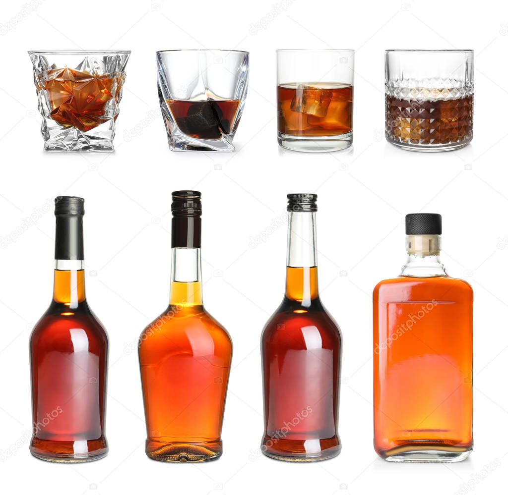 Set of bottles and glasses with expensive whiskey on white background