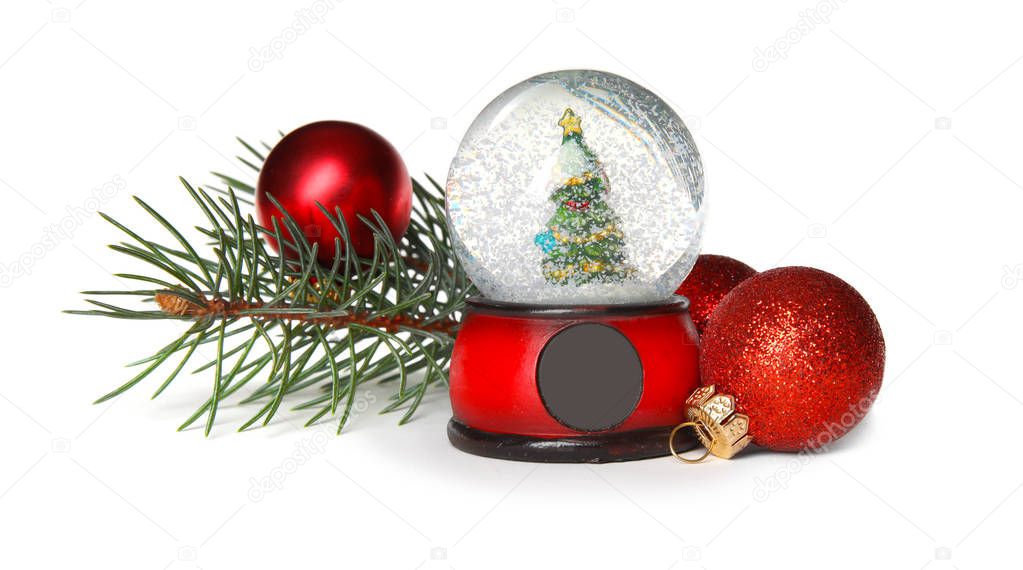 Magical snow globe with pine branches and Christmas balls on white background