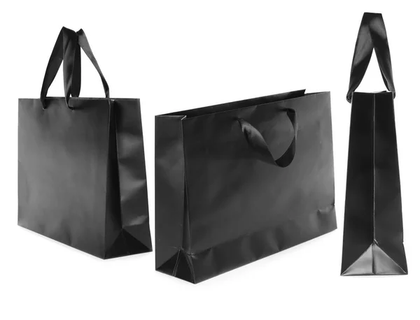 一套黑色纸袋 用于在白色背景上购物 用于设计的模型 — 图库照片