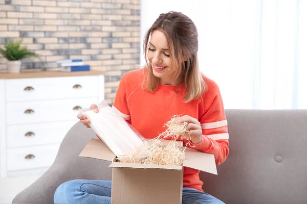 Young Woman Opening Parcel Sofa Living Room — Stock Photo, Image