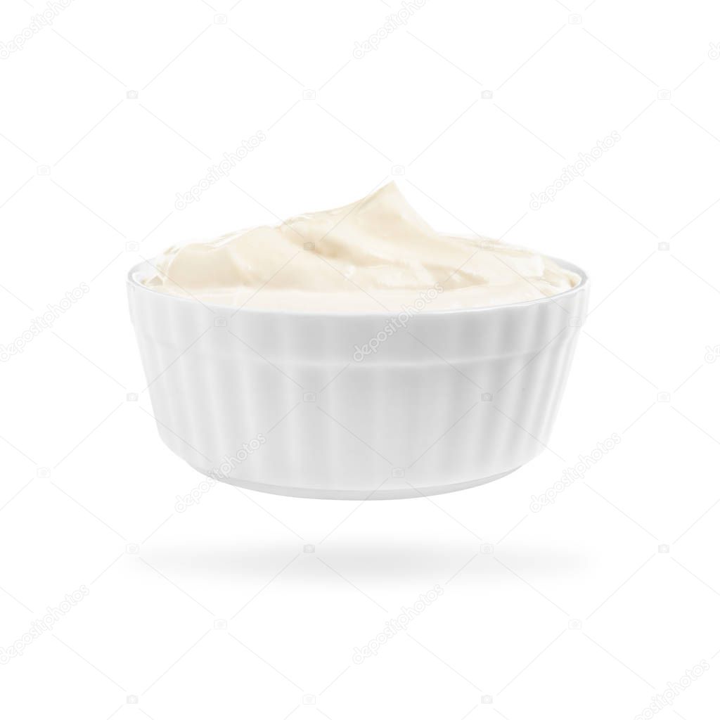 Ceramic bowl with delicious sour cream on white background