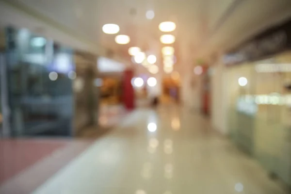 Blurred view of shopping mall entrance hall interior