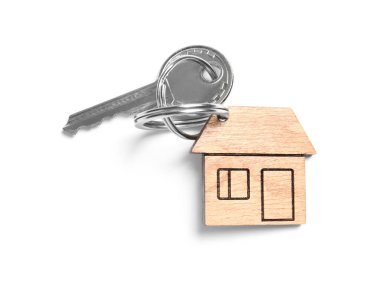 Evin anahtarı ile biblo beyaz arka planda, üstten görünüm