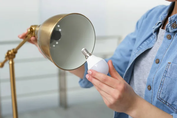 Woman Changing Light Bulb Lamp Indoors Closeup — Stock Photo, Image