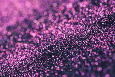 Koyu arka plan üzerinde bokeh etkisi ile pembe glitter