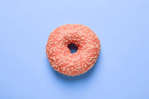 Köstliche Donut Mit Orangenglasur Und Streusel Auf Blauem Hintergrund Draufsicht — Stockfoto