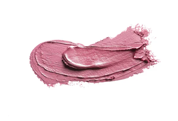 Pink lipstick smear on white background. Cosmetic product