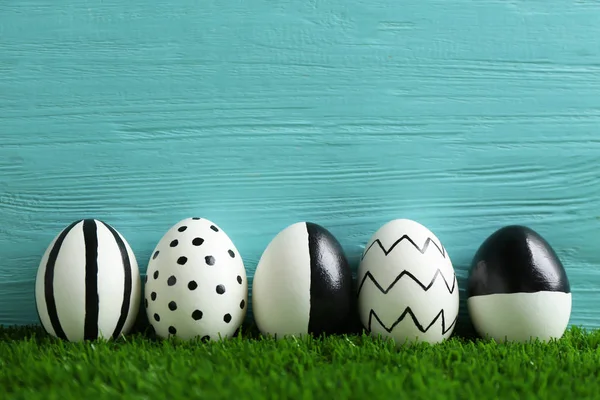Line Painted Easter Eggs Green Lawn Wooden Background Space Text — Stock Photo, Image