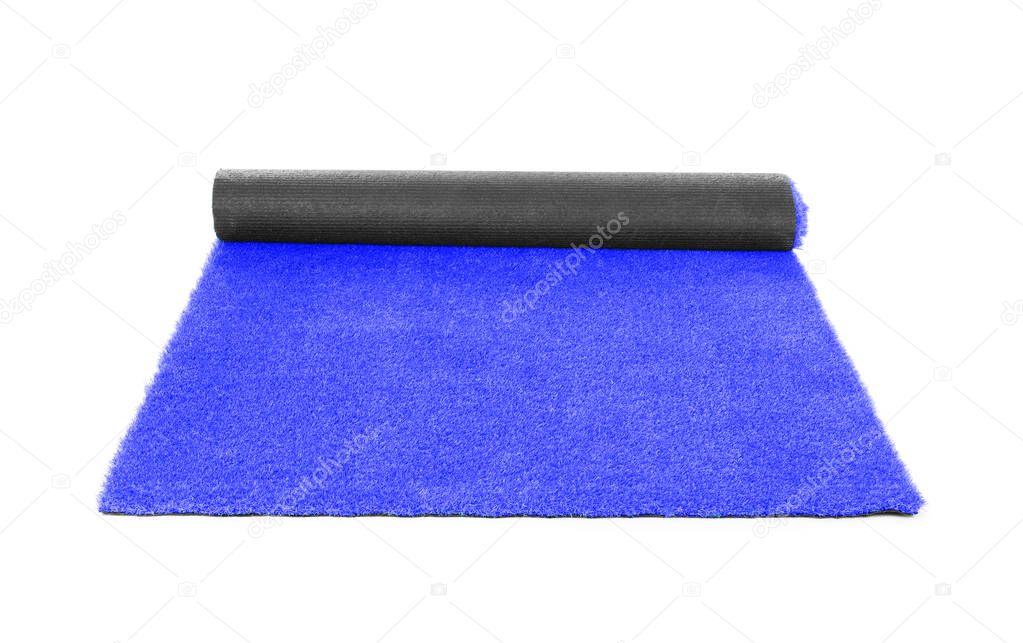 Rolling bright blue carpet on white background