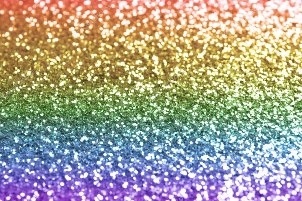 Composition of sparkling rainbow glitter as background