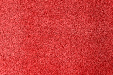Arka plan, üstten görünüm olarak parlak kırmızı halı 