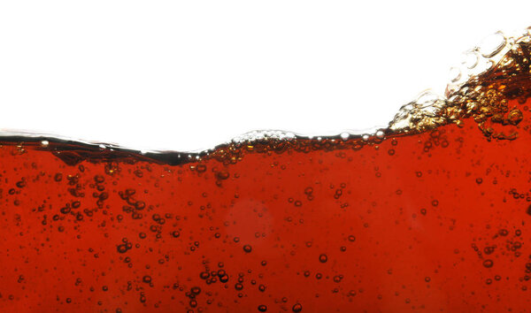 Closeup view of tasty refreshing cola on white background