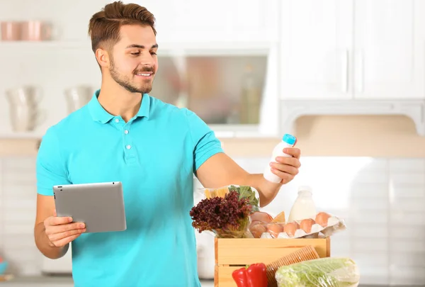 Young Man Eating Tasty Burger Color Background Space Text — Stock Photo, Image