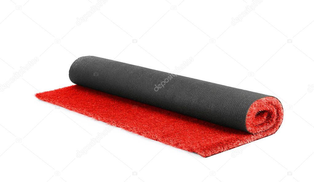 Rolled bright red carpet on white background