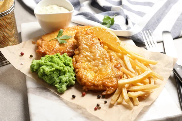 British traditional fish and potato chips on table