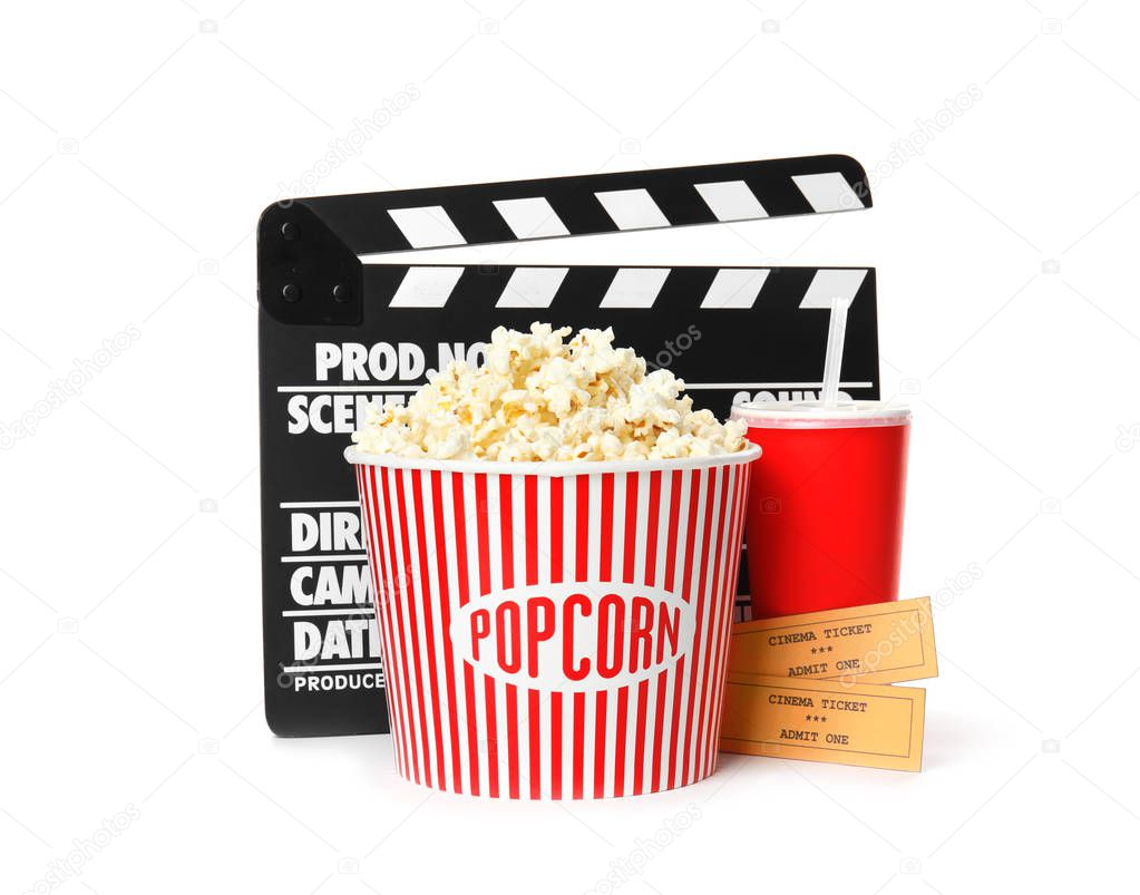 Popcorn bucket, clapper, drink and tickets isolated on white. Cinema snack