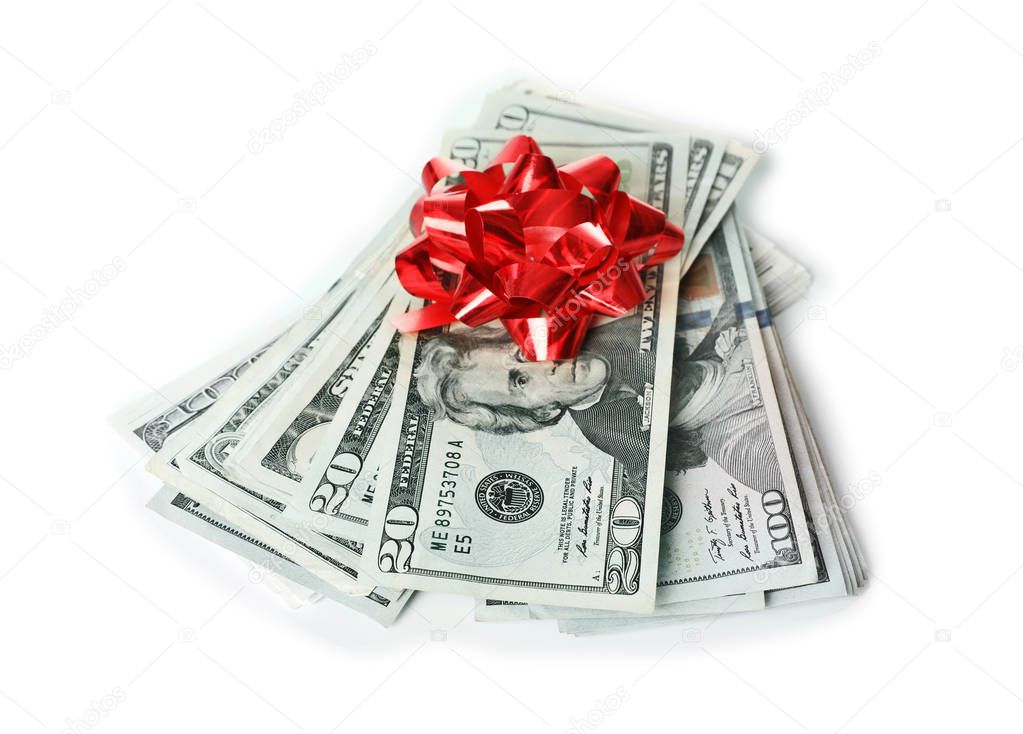 Pile of dollar banknotes with bow on white background