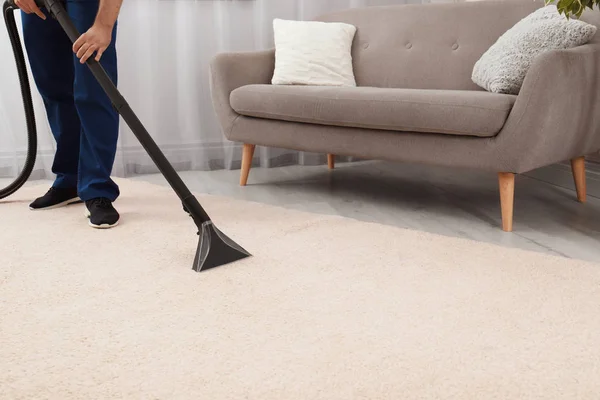 Man Removing Dirt Carpet Vacuum Cleaner Indoors Closeup Space Text — Stock Photo, Image