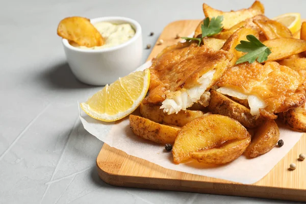 British traditional fish and potato chips on table. Space for text