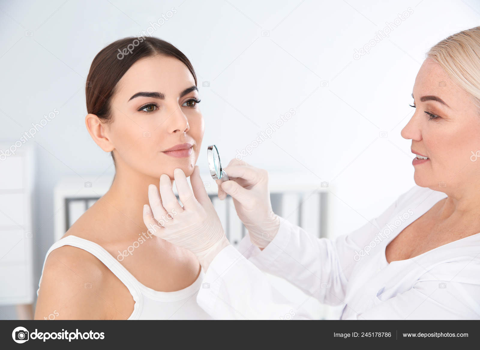 Dermatologist Examining Young Patients Birthmark Magnifying Glass