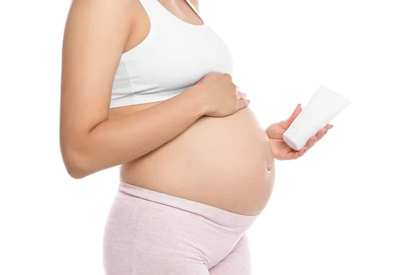 Mujer Embarazada Sosteniendo Crema Corporal Sobre Fondo Blanco Primer Plano —  Fotos de Stock