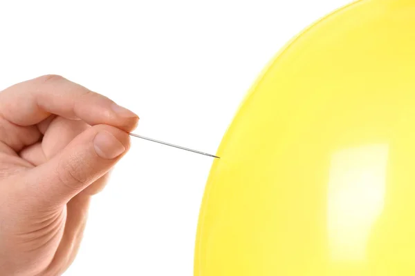 Woman Piercing Yellow Balloon White Background Closeup — Stock Photo, Image