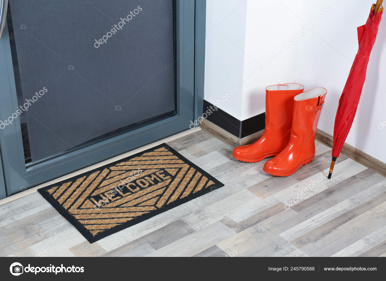 Rubber Boots Umbrella Mat Door Hallway Stock Photo by ©NewAfrica
