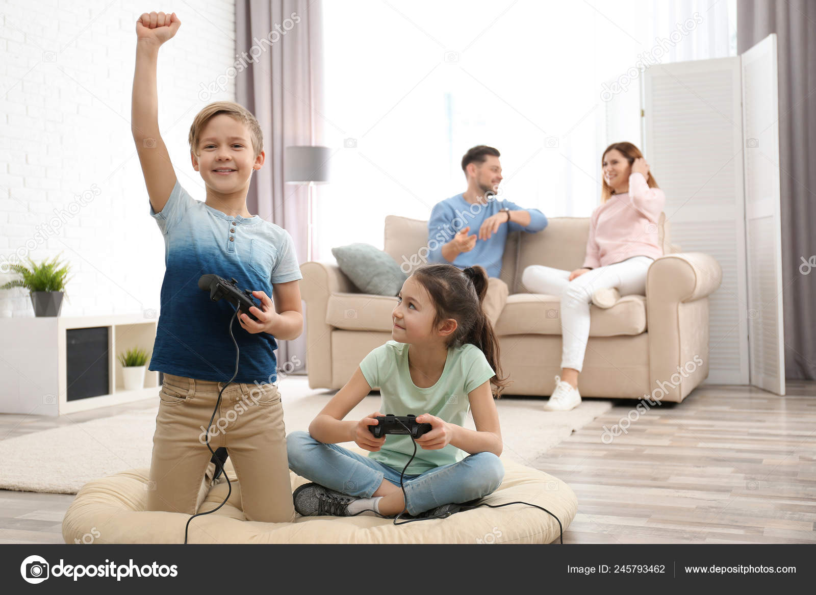 Cute Children Playing Video Games While Parents Resting Sofa Home