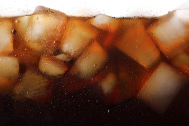 Closeup view of tasty refreshing cola with ice cubes clipart