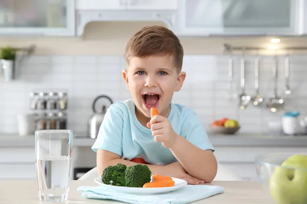 Adorable Little Boy Eating Vegetables Table Kitchen — Stock Photo, Image