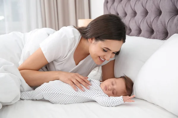 Happy Woman Her Sleeping Baby Bed — Stock Photo, Image