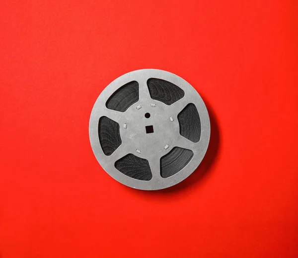 Movie reel on color background, top view. Cinema production