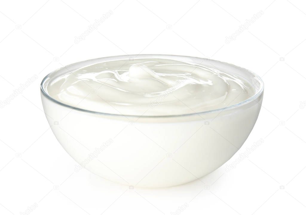 Glass bowl with creamy yogurt on white background