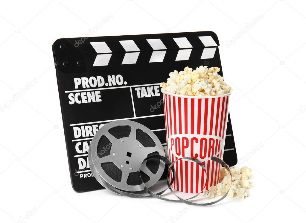 Popcorn, clapper and reel isolated on white. Cinema snack