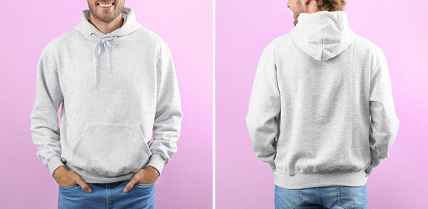 Man in blank hoodie sweater on color background, closeup. Mock up for desing