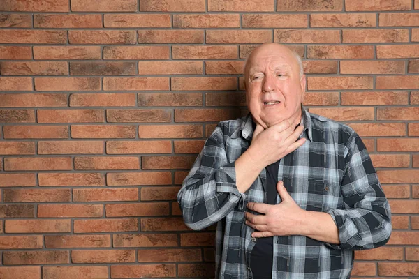 Senior Man Suffering Cough Brick Wall Space Text — Stock Photo, Image