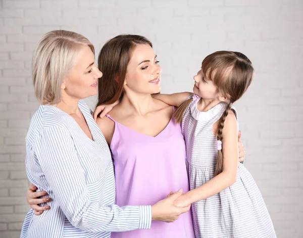 Beautiful Mature Woman Daughter Grandchild Brick Wall — Stock Photo, Image