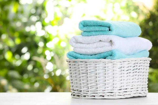 Basket Soft Bath Towels Table Blurred Background Space Text — Stock Photo, Image