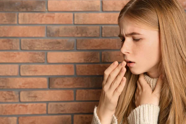 Teenage Girl Suffering Cough Brick Wall Space Text — Stock Photo, Image