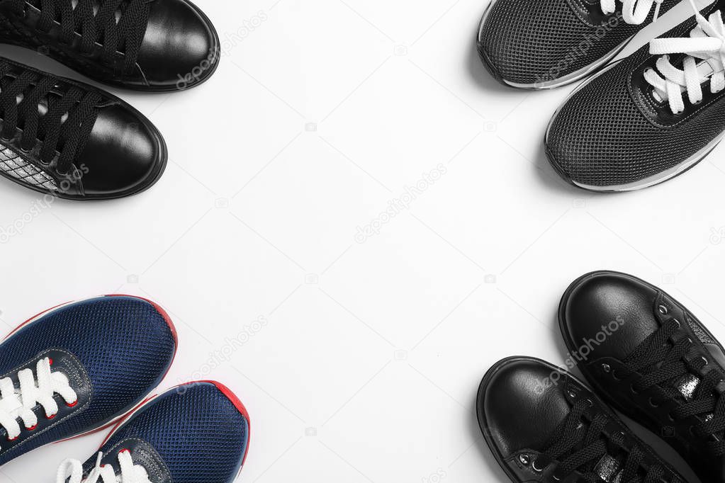 Flat lay composition of stylish shoes on white background, space for text