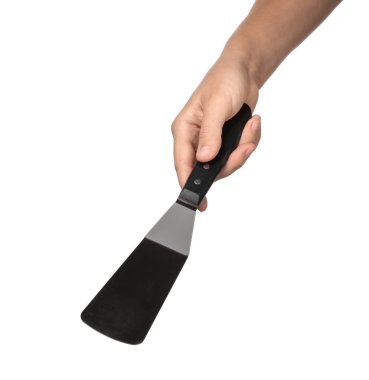 Spatula beyaz arka plan üzerinde tutan kadın. Mutfak gereçleri