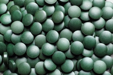 Arka plan, closeup görünümü yeşil spirulina ilaçlar