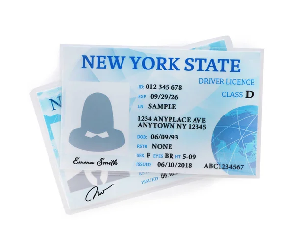 American driving licenses on white background, top view