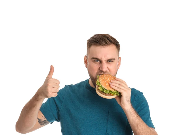 Young Man Eating Tasty Burger White Background — Stock Photo, Image